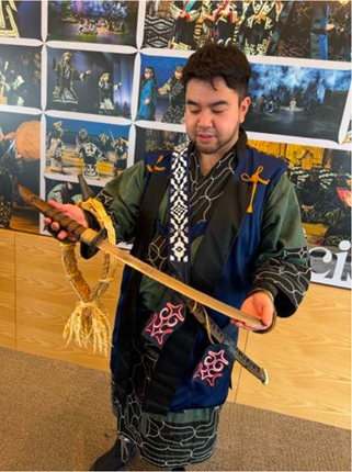 Figure 14. An Ainu leader and performer demonstrating the use of their traditional sword