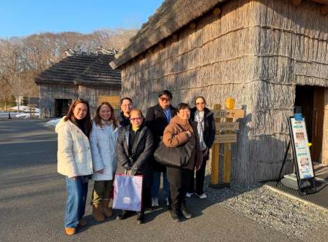 Figure 17. Photo opportunity in front of a Kota, a traditional Ainu house